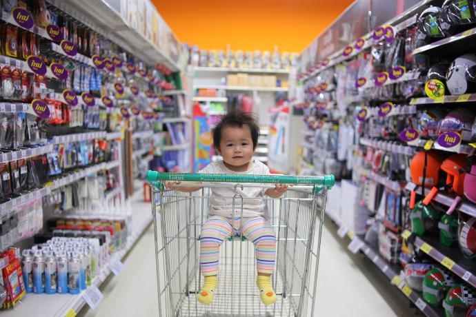 baby on white shopping cart